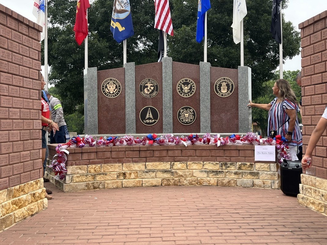 Veterans memorial wall with service branch plaques