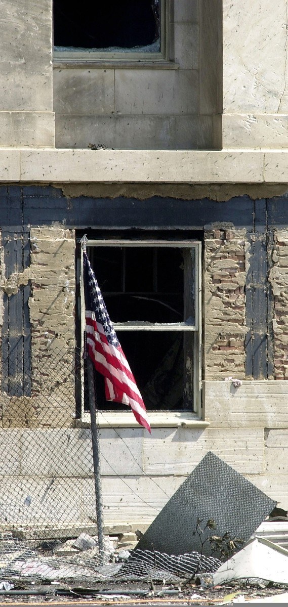 American flag on the damaged Pentagon wall after the attack